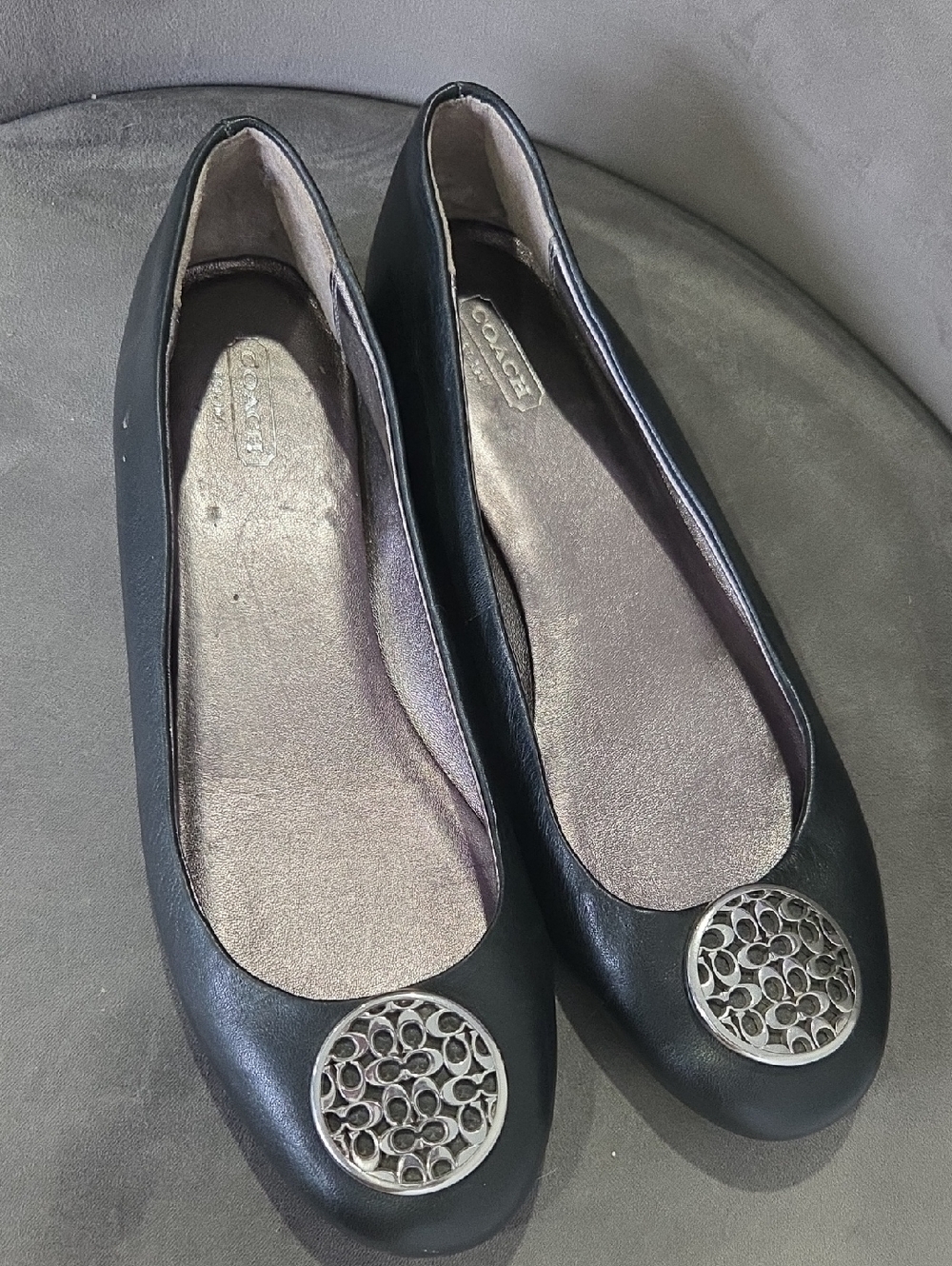 Coach Black Leather Ballet Flats with Silver Logo Medallion